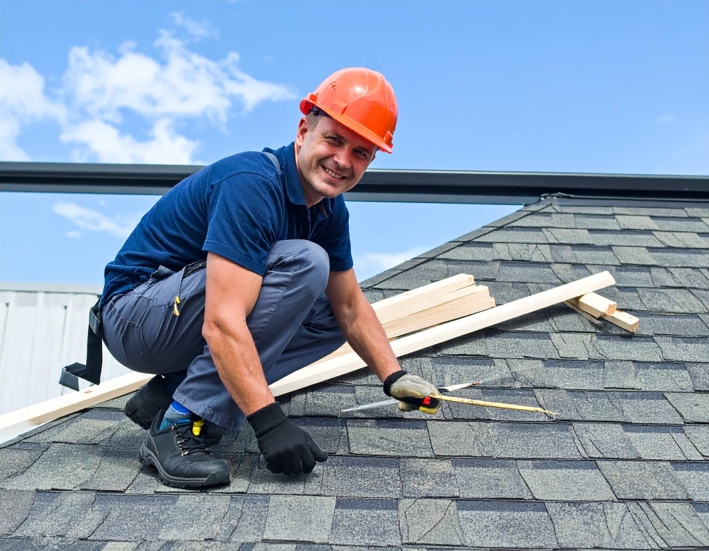 roofer on the shingle roof